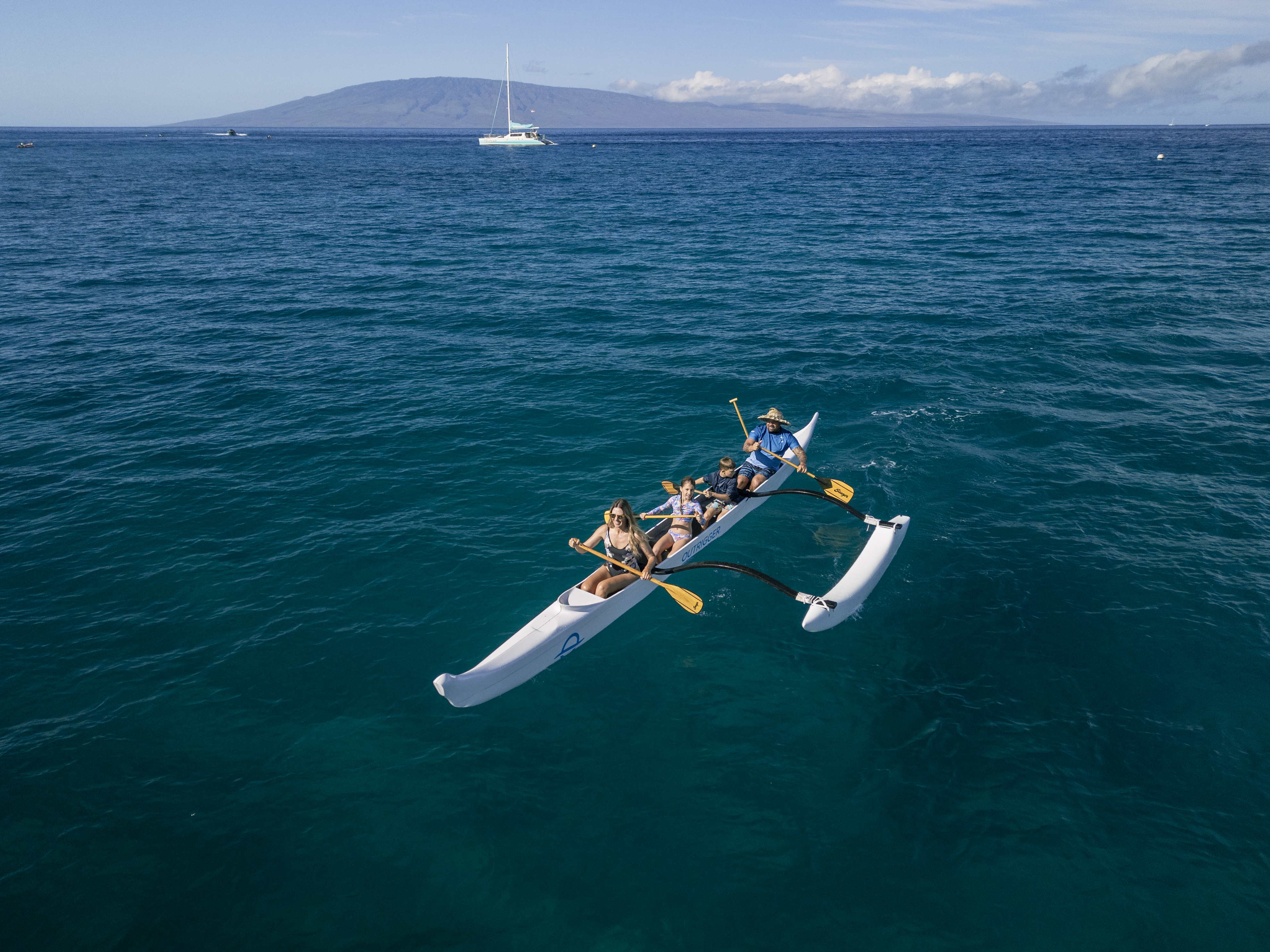 Outrigger canoe riding in the ocean