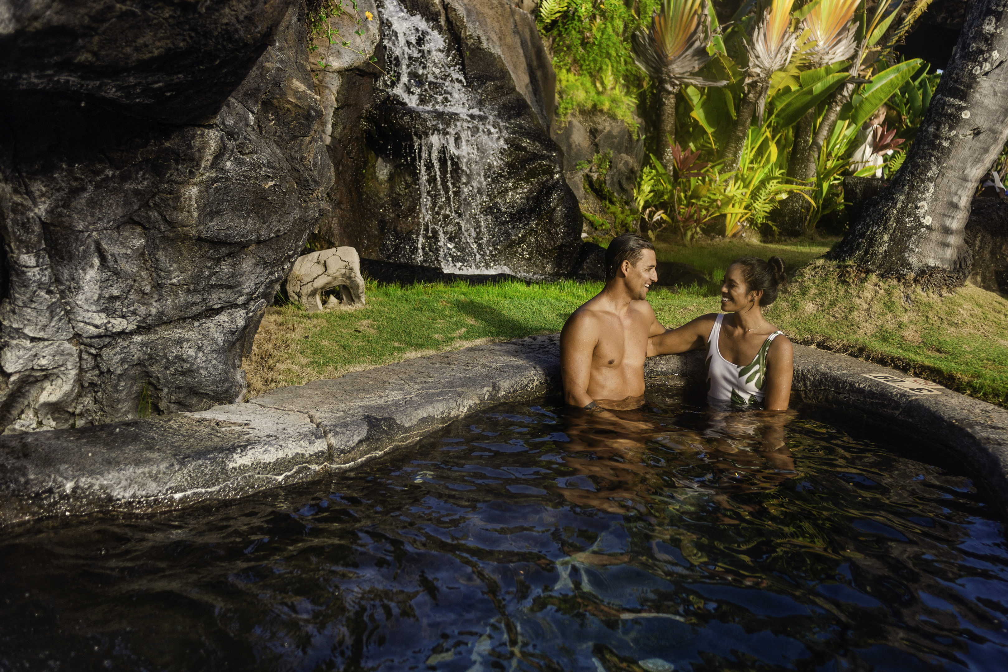 Couple in the pool at OUTRIGGER Kauai Beach Resort & Spa