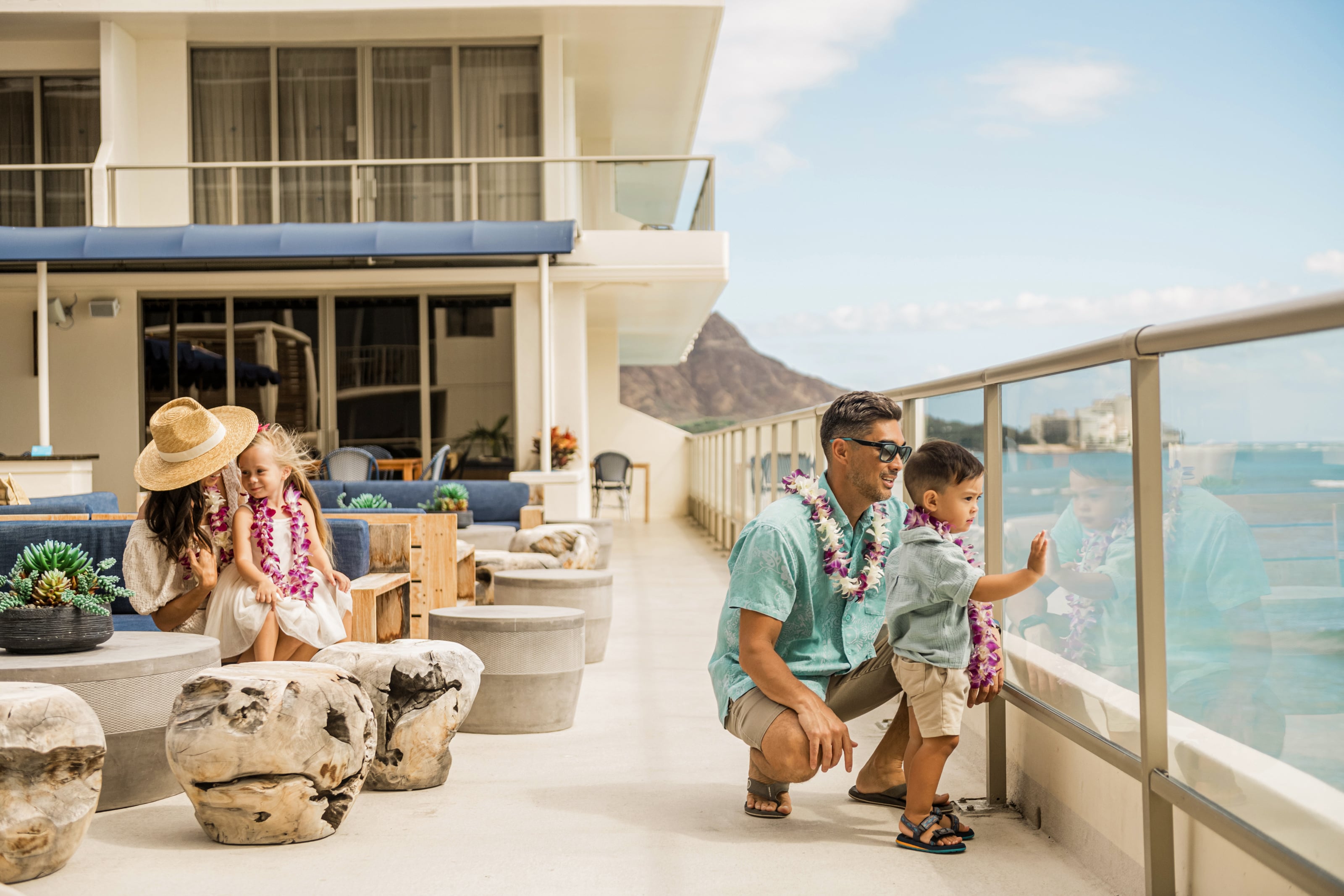 Family enjoying the view at the Voyager 47 Club Lounge at OUTRIGGER Reef Waikiki Beach Resort