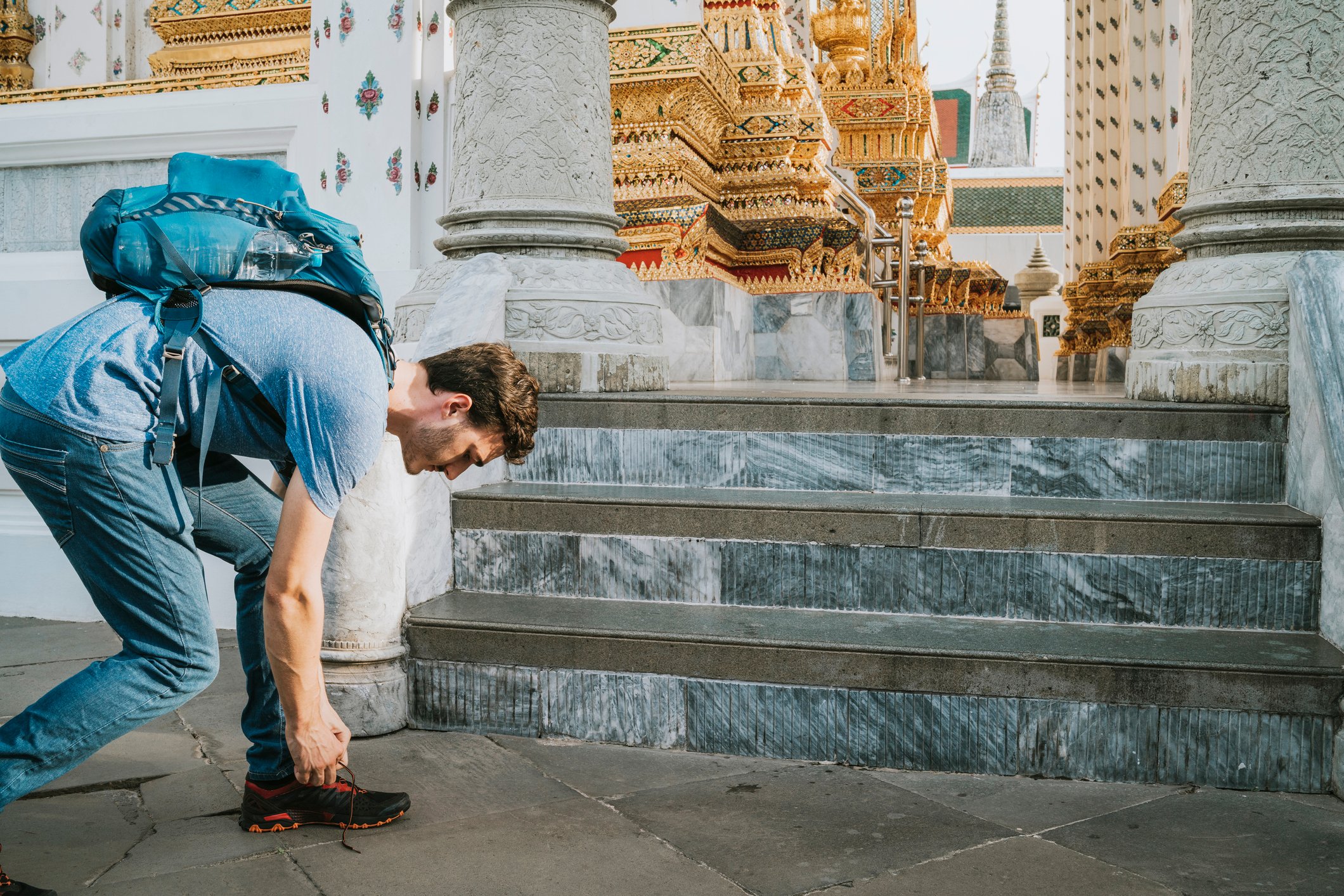 Removing shoes before entering Thailand temple